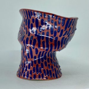 This was a part of my AP ceramics portfolio, I used an air pressure pen for the blue slip.   I love the movement of this piece and the dripping effect I created.
