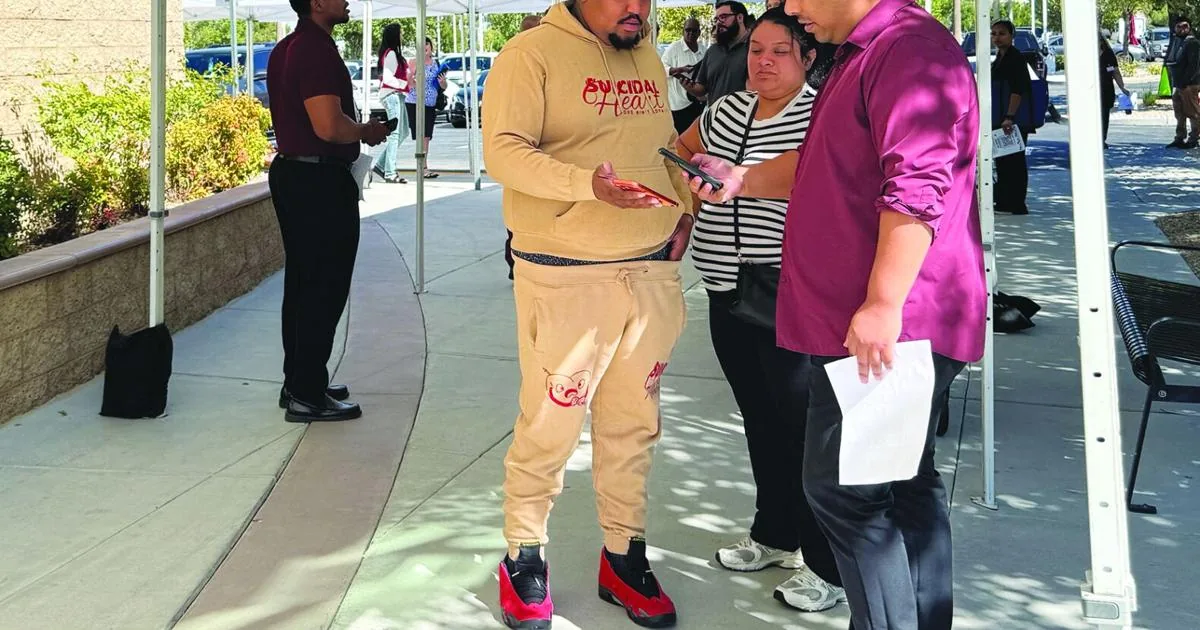 Job seekers line up outside the Walther Center at West Coast Baptist College during a Lancaster job fair